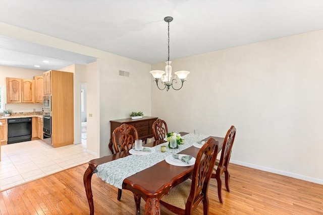 31 Swing Dr, Berkley, MA 02779 - dining room featuring light wood-style floors and a chandelier