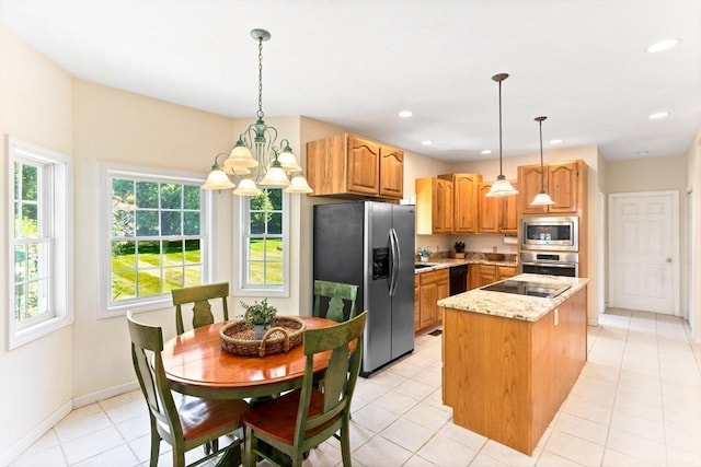 31 Swing Dr, Berkley, MA 02779 - kitchen featuring black appliances, a center island, a chandelier, light stone countertops, and light tile patterned floors