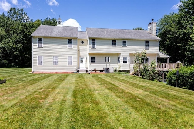 31 Swing Dr, Berkley, MA 02779 - back of house featuring a chimney, a lawn, and entry steps