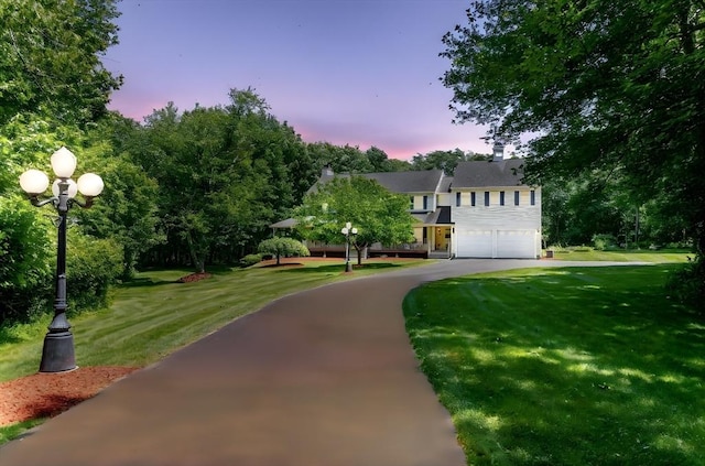 31 Swing Dr, Berkley, MA 02779 - view of front of house with a garage, a front lawn, and asphalt driveway