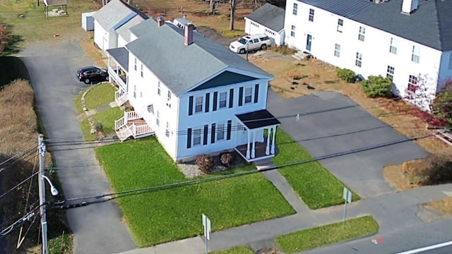 birds eye view of property with a residential view