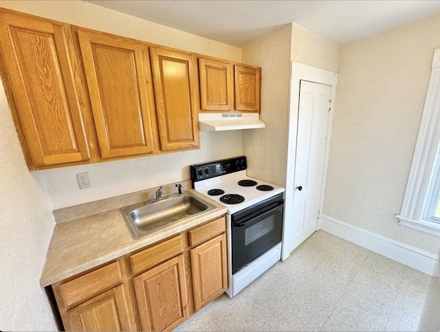 kitchen with electric range oven, light countertops, a sink, and under cabinet range hood