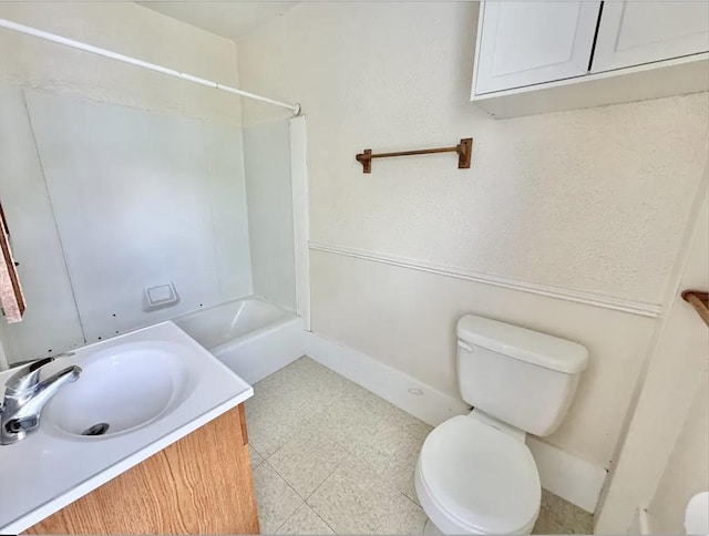 bathroom featuring shower / bathtub combination, vanity, toilet, and tile patterned floors