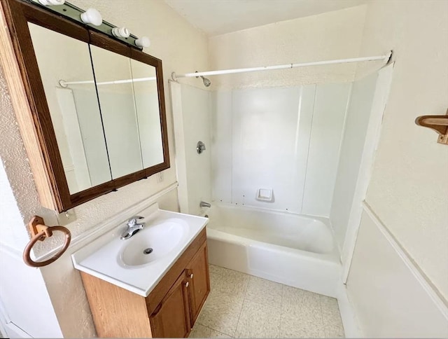 bathroom with shower / bathing tub combination and vanity