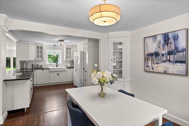 8 Winthrop Ave, Bedford, MA 01730 - dining area featuring dark wood finished floors and baseboards