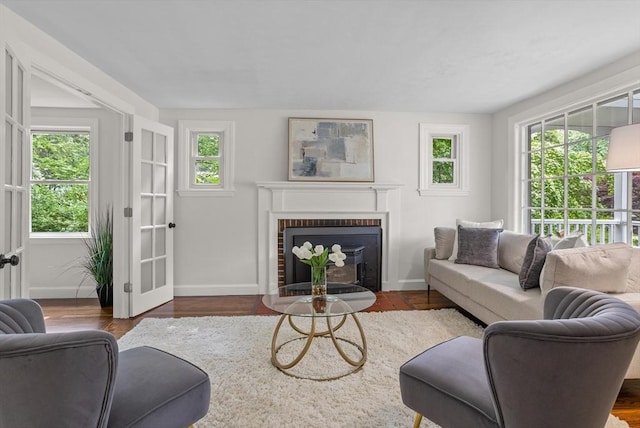 8 Winthrop Ave, Bedford, MA 01730 - living area with a brick fireplace and wood finished floors
