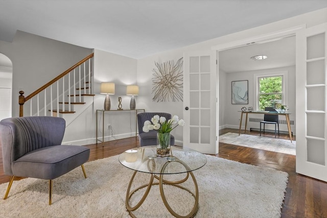 8 Winthrop Ave, Bedford, MA 01730 - living area with radiator heating unit, stairs, a desk, and wood finished floors