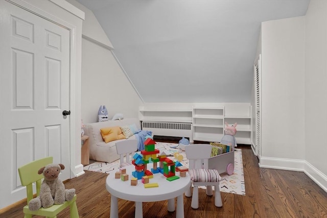 8 Winthrop Ave, Bedford, MA 01730 - playroom with radiator, wood finished floors, and vaulted ceiling