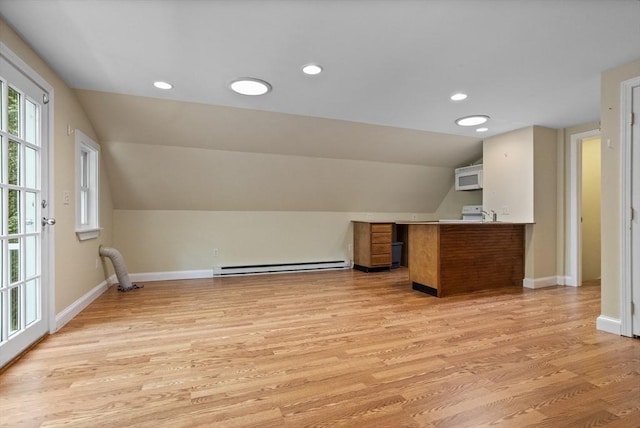 8 Winthrop Ave, Bedford, MA 01730 - bonus room featuring a baseboard heating unit, vaulted ceiling, light wood-style flooring, and recessed lighting