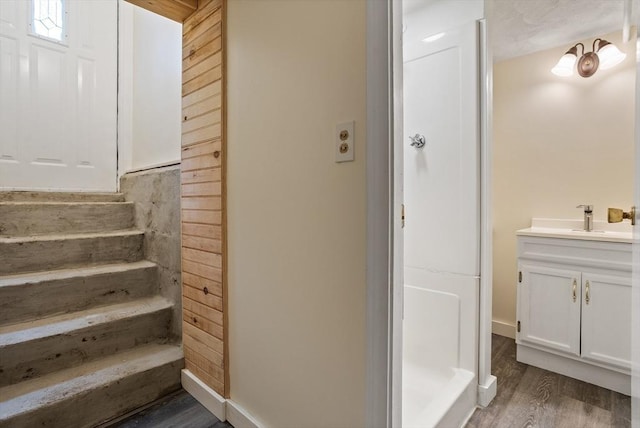 8 Winthrop Ave, Bedford, MA 01730 - full bath with vanity, wood finished floors, and walk in shower