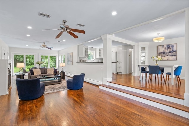 8 Winthrop Ave, Bedford, MA 01730 - living room with recessed lighting, wood finished floors, a baseboard radiator, and a ceiling fan