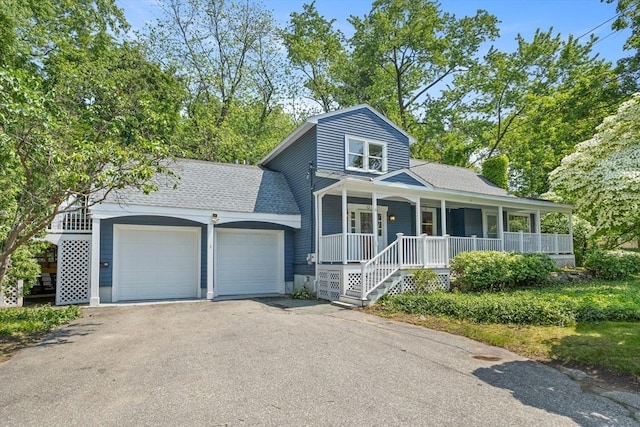 8 Winthrop Ave, Bedford, MA 01730 - view of front of house featuring a porch, asphalt driveway, an attached garage, and roof with shingles