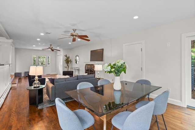 8 Winthrop Ave, Bedford, MA 01730 - dining area featuring ceiling fan, recessed lighting, wood finished floors, and a fireplace