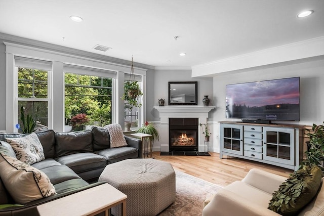 100 Burrill St Unit 3, Swampscott, MA 01907 - living area featuring a fireplace with flush hearth, wood finished floors, ornamental molding, and recessed lighting