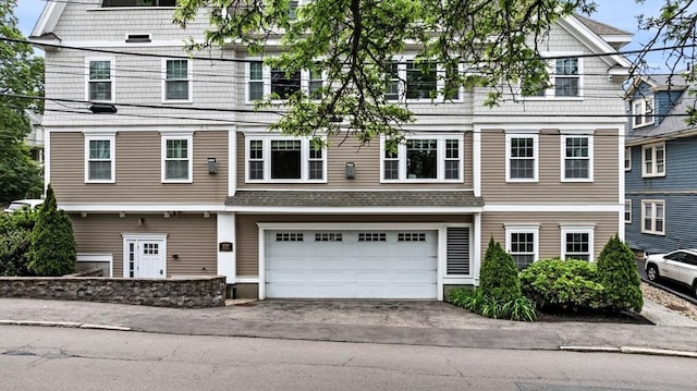 100 Burrill St Unit 3, Swampscott, MA 01907 - view of front of house featuring an attached garage and asphalt driveway