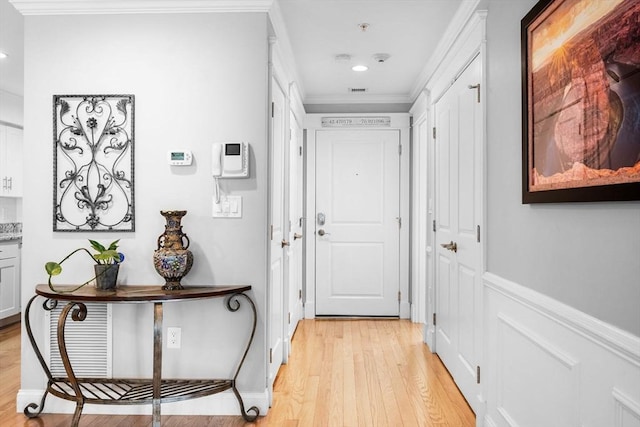 100 Burrill St Unit 3, Swampscott, MA 01907 - doorway featuring light wood-type flooring, ornamental molding, recessed lighting, and wainscoting