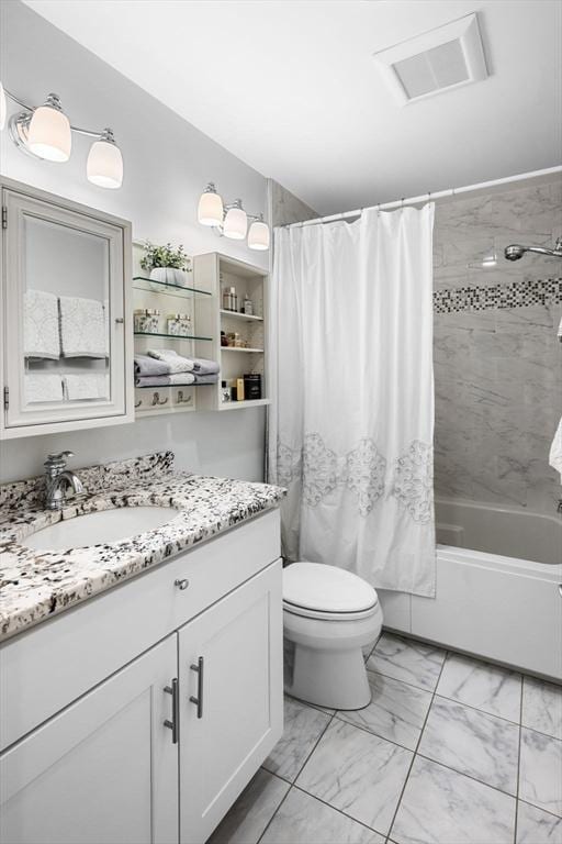 100 Burrill St Unit 3, Swampscott, MA 01907 - bathroom featuring vanity, marble look tiles, shower / bath combination with curtain, and toilet