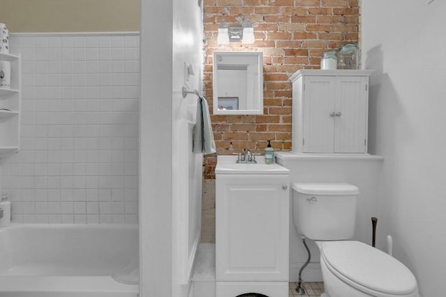 201 High St, Brookline, MA 02445 - bathroom featuring a sink, toilet, tile patterned flooring, brick wall, and shower / bathtub combination