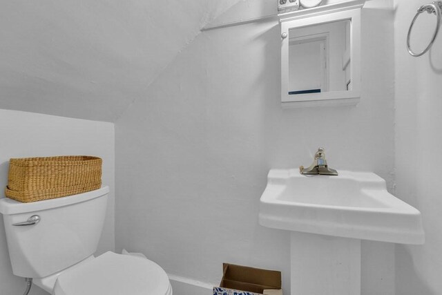 201 High St, Brookline, MA 02445 - bathroom featuring toilet and lofted ceiling
