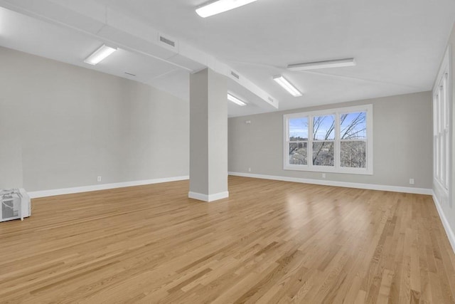 201 High St, Brookline, MA 02445 - below grade area with light wood-type flooring and baseboards