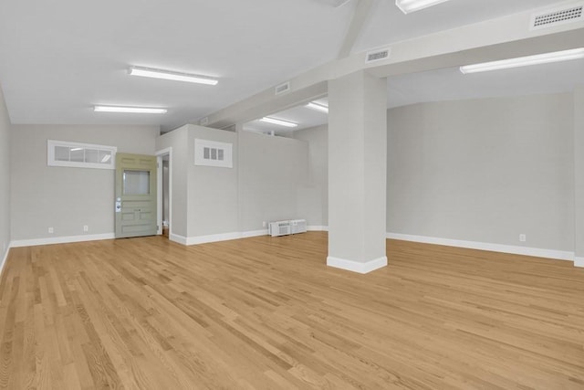 201 High St, Brookline, MA 02445 - below grade area with light wood-type flooring and baseboards