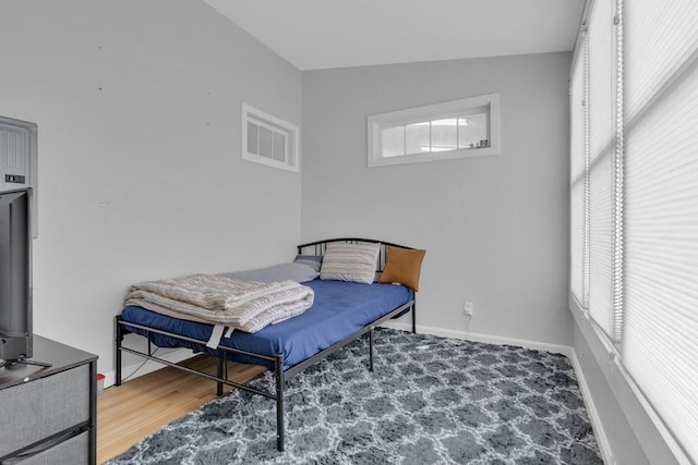 201 High St, Brookline, MA 02445 - bedroom featuring baseboards and wood finished floors