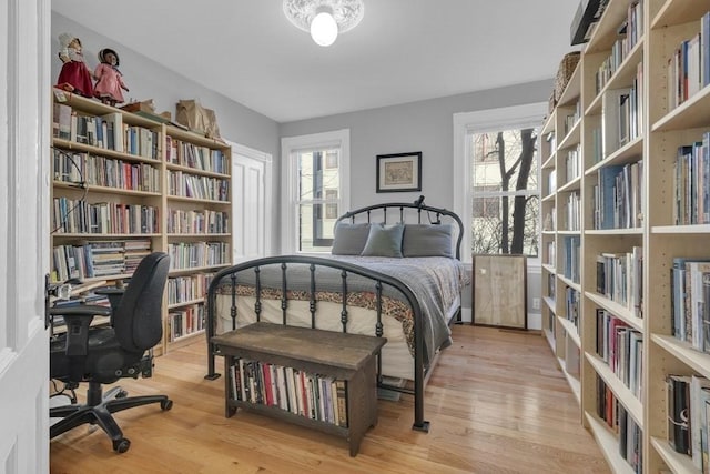 201 High St, Brookline, MA 02445 - bedroom with wood finished floors, multiple windows, and a desk