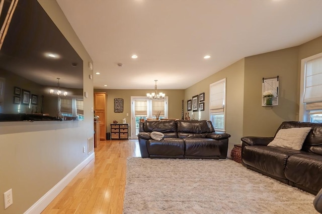 578-580 Detroit St, Fall River, MA 02721 - living room featuring a chandelier, light wood-style floors, recessed lighting, healthy amount of natural light, and baseboards