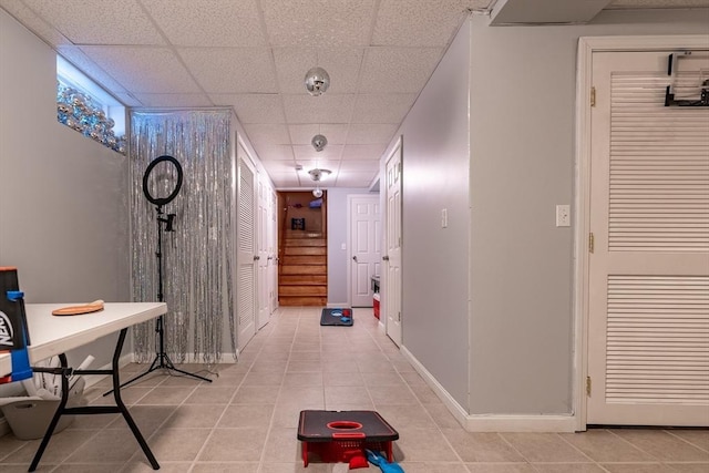 578-580 Detroit St, Fall River, MA 02721 - corridor with light tile patterned floors, stairs, a paneled ceiling, and baseboards