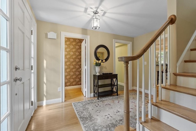 62 Waite Rd, Boxborough, MA 01719 - foyer entrance featuring light wood-type flooring, stairs, and baseboards