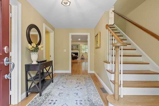 62 Waite Rd, Boxborough, MA 01719 - entrance foyer with wood finished floors, stairs, and baseboards