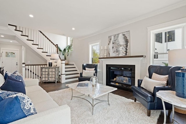 living area with crown molding, recessed lighting, stairs, and wood finished floors