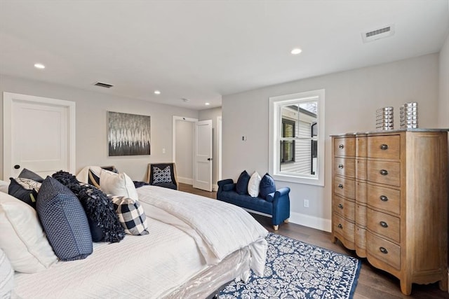 bedroom featuring dark wood-type flooring, recessed lighting, and visible vents
