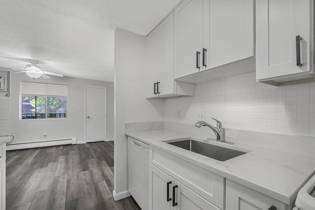 64 Main St Unit 25B, Stoneham, MA 02180 - kitchen with dishwasher, baseboard heating, white cabinetry, backsplash, and a textured ceiling
