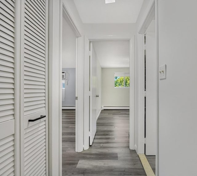 64 Main St Unit 25B, Stoneham, MA 02180 - hallway with a baseboard heating unit, wood finished floors, and a baseboard radiator