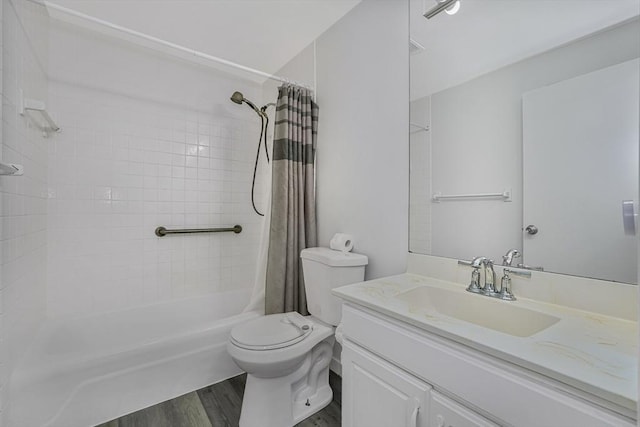 64 Main St Unit 25B, Stoneham, MA 02180 - bathroom featuring vanity, wood finished floors, and shower / tub combo