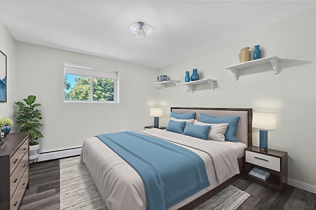 64 Main St Unit 25B, Stoneham, MA 02180 - bedroom with baseboard heating and dark wood-style flooring