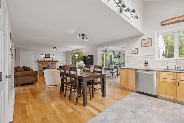 17 Lantern Ln, Leominster, MA 01453 - dining space featuring healthy amount of natural light, a brick fireplace, and light wood-style floors