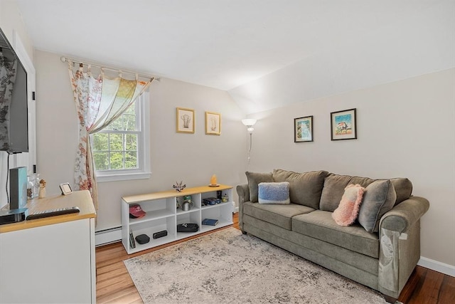 17 Lantern Ln, Leominster, MA 01453 - living room featuring a baseboard heating unit, wood finished floors, baseboards, and vaulted ceiling