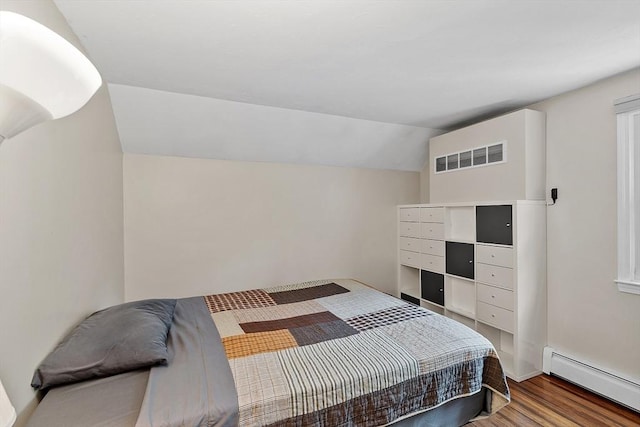 17 Lantern Ln, Leominster, MA 01453 - bedroom with a baseboard heating unit, wood finished floors, and lofted ceiling