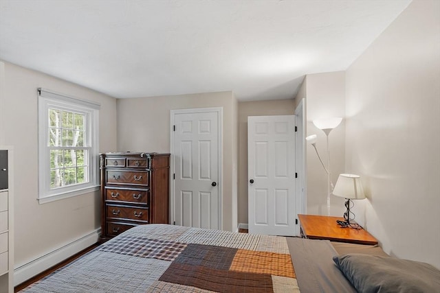17 Lantern Ln, Leominster, MA 01453 - bedroom with a baseboard heating unit, baseboards, and wood finished floors