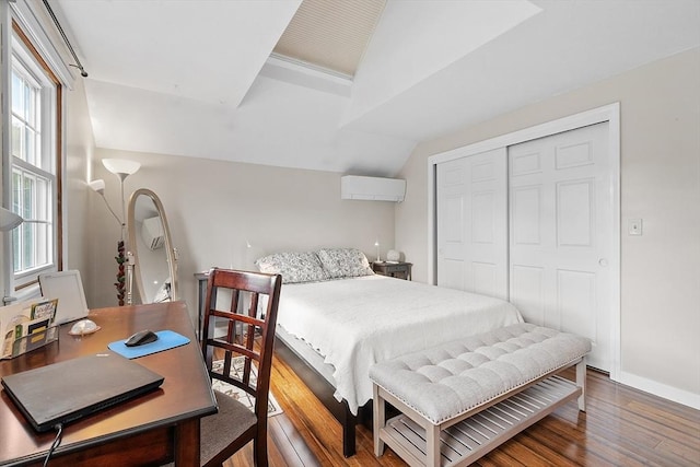 17 Lantern Ln, Leominster, MA 01453 - bedroom featuring lofted ceiling, wood finished floors, a closet, baseboards, and a wall mounted AC
