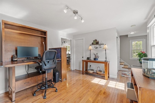 17 Lantern Ln, Leominster, MA 01453 - home office featuring a baseboard heating unit, light wood finished floors, and baseboards