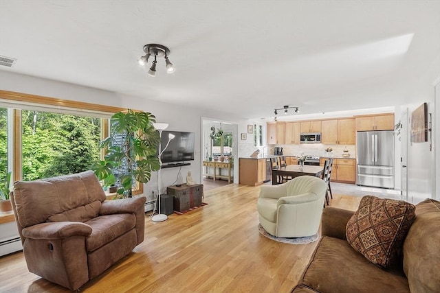 17 Lantern Ln, Leominster, MA 01453 - living area with light wood-style floors and rail lighting