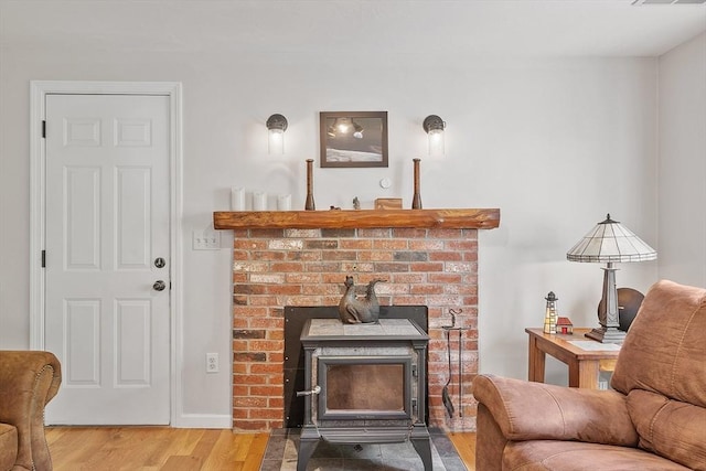 17 Lantern Ln, Leominster, MA 01453 - living area with a wood stove and wood finished floors
