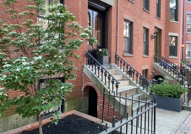 view of building exterior with entry steps