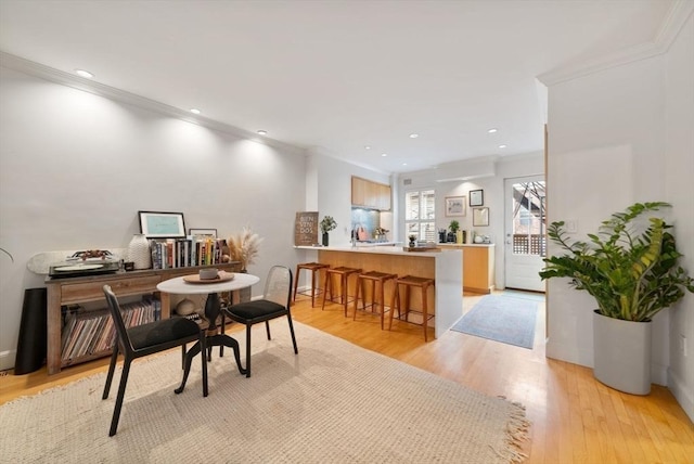 office area with ornamental molding, recessed lighting, and light wood-style flooring