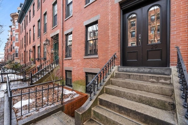 property entrance with brick siding