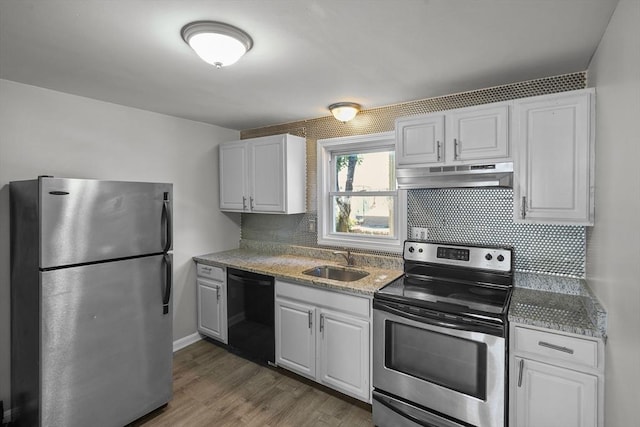 kitchen featuring backsplash, white cabinetry, and stainless steel appliances