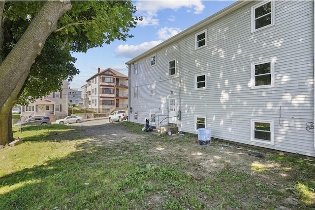 rear view of house with a lawn